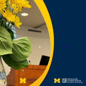 Maize and blue image of ISR podium with flowers in the foreground